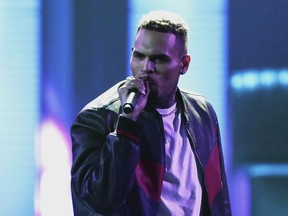 In this June 25, 2017, file photo, Chris Brown performs at the BET Awards at the Microsoft Theater in Los Angeles. Brown released a 45-song album "Heartbreak on a Full Moon" on Tuesday, Oct. 31.