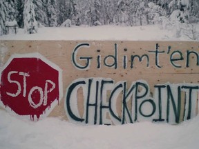 A sign for a blockade check point by the Gidimt'en clan of the Wet'suwet'en First Nation is shown in this undated handout photo posted on the Wet'suwet'en Access Point on Gidumt'en Territory Facebook page.