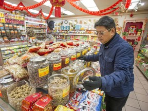 Robert Sung looks over preparations for the lunar new year in Vancouver's Chinatown.