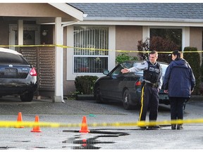 RCMP on scene at the 9500-block of Prince Charles Boulevard, in Surrey on Thursday. A teenager is in serious condition in hospital after he was shot in a targeted hit late Wednesday night.