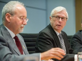 FILE PHOTO: Gary Lenz (left) and Craig James speak at Fasken Martineau DuMoulin LLP in Vancouver, BC, Nov. 26, 2018.