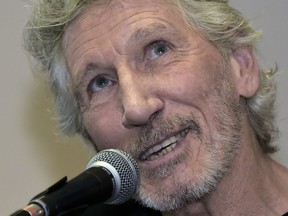 British rock icon and activist Roger Waters, attends a press conference along with victims of environmental damage caused during oil operations in the Ecuadoran Amazon blamed on US company Texaco -which Chevron acquired in 2001- in Quito on November 20, 2018. - Waters visited the affected area, and gave his support to Ecuadoran indigenous who have been involved in a long legal dispute with the energy company in demand of compensation for the damage.