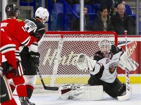 Vancouver Giants goalie David Tendeck makes a save against the Portland Winterhawks.