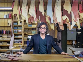 Domenico Vacca at the cutting table at Giovanni Clothes on St-Laurent Blvd. His father Giovanni founded the company in 1965. in the company's shop where made-to-measure suits and jackets are made in Montreal Friday February 15, 2019. (John Mahoney / MONTREAL GAZETTE) ORG XMIT: 62123 - 7781