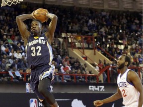 FILE - In this Aug. 1, 2015 file photo, Team World's Jeff Green of Memphis Grizzlies, left, goes up for a shot as Team Africa's Luc Mbah a Moute  from Cameroon , looks on during the NBA Africa Game at Ellis Park Arena in Johannesburg, South Africa.  The NBA will open an academy in Africa in 2017, its latest move to unearth talent from outside the United States and extend the league's reach into new territories.