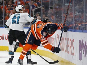 Edmonton Oilers' Leon Draisaitl (29) battles San Jose Sharks' Justin Braun (61) during the first period of a NHL game at Rogers Place in Edmonton, on Saturday, Feb. 9, 2019. Photo by Ian Kucerak/Postmedia