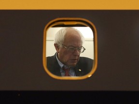 Then-Democratic presidential candidate Sen. Bernie Sanders is seen through the window of his plane on the tarmac at Signature Flight Support as he continues to campaign on February 18, 2016 in Las Vegas, Nevada.