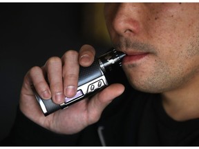 FILE PHOTO: A man using a vape pen. A B.C. woman wants to introduce a pot testing kit into schools that would allow administrators to know whether there is THC on things like vape pens and candy.