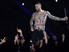 Lead vocalist of Maroon 5 Adam Levine performs during the halftime show of Super Bowl LIII between the New England Patriots and the Los Angeles Rams at Mercedes-Benz Stadium in Atlanta, Georgia, on February 3, 2019.