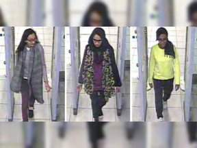 Kadiza Sultana, left, Shamima Begum, centre, and Amira Abase going through security at Gatwick airport, south England, before catching their flight to Turkey. Shamima Begum told The Times newspaper in a story published Thursday Feb. 14, 2019, that she wants to come back to London.