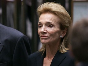FILE - In this July 23, 1999 file photo, Lee Radziwill, sister of Jacqueline Kennedy Onassis, leaves the Church of St. Thomas More in New York. Radziwill, the stylish jet setter and socialite who made friends worldwide even as she bonded and competed with her older sister Jacqueline Kennedy, has died. She was 85. Anna Christina Radziwill told The New York Times her mother died Friday, Feb. 15, 2019, of what she described as natural causes.