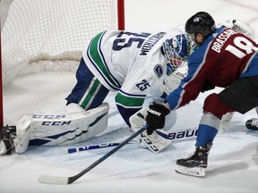 Vancouver Canucks goaltender Jacob Markstrom stops Colorado Avalanche centre Derick Brassard during the shootout of the Avalanche's 3-2 win in Denver Wednesday night.