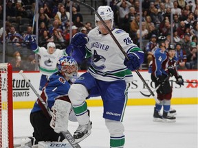 Antoine Roussel celebrates his goal to give the Canucks a 3-0 lead Saturday en route to 5-1 triumph.