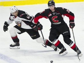 Vancouver Giants Alex Kannok Leipert and Prince George Cougars Connor Bowie battle for the puck n the first period of a regular season WHL hockey game at the LEC, Langley,  February 02 2019.