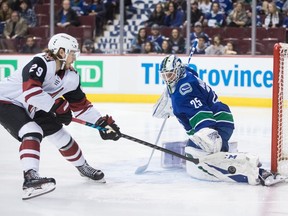 Jacob Markstrom stops Mario Kempe in the first period Thursday.