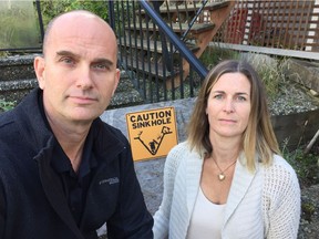 Ross and Erin Storey are paying a mortgage on a house they can't set foot in after a sink hole opened up in their front yard in Sechelt.