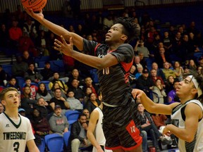 Uyi Ologhola (#10) of Holy Cross goes up for a basket against Lord Tweedsmuir in the Fraser Valley senior boys 4A semifinal Feb. 21 at the Langley Events Centre. Photo courtesy of Gary Ahuja.