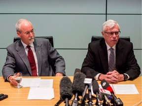 Sergeant-at-Arms Gary Lenz (left) and Clerk of the Legislative Assembly Craig James make a statement to media in Vancouver on Nov. 26, 2018.