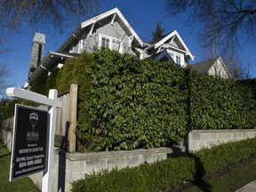 A house for sale in Vancouver. Sagging sales and dropping prices will reduce provicnial tax revenue.