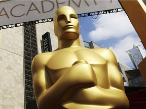 FILE - In this Feb. 21, 2015, file photo, an Oscar statue appears outside the Dolby Theatre for the 87th Academy Awards in Los Angeles. The 91st Academy Awards will be held on Sunday. (Photo by Matt Sayles/Invision/AP, File) ORG XMIT: NYET502