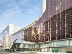 The Parq Vancouver features two high-end hotels — the DOUGLAS on the left, the JW Marriott Parq Vancouver on the right — and a two-level casino with floor-to-ceiling windows in the middle.