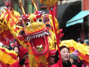 The dragon makes its entry during the 46th annual Vancouver Chinatown Spring Festival Parade in Vancouver on Feb. 10.