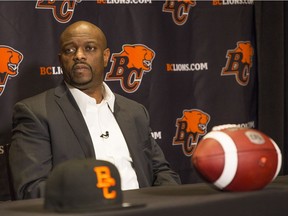 B.C. Lions general manager Ed Hervey sports a serious look in listening to a reporter’s question during Tuesday’s news conference announcing the signing of free-agent quarterback Mike Reilly.