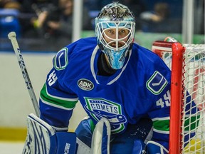 Michael Leighton follows the play while in action for the AHL’s Utica Comets.