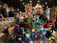Sam Lysne holds up He-Man behind some other items he is selling during Vancouver Comic and Toy Show at the PNE Forum in Vancouver, BC, Feb. 24, 2019. The show takes over 22,000 square feet with more than 200 tables filled with priceless comics, toys and collectibles.
