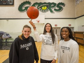 Walnut Grove secondary school Gators basketball players Tavia Rowell, Jessica Wisotzki and Rolande Taylor (left to right) have been teammates, and fast friends, for six seasons.