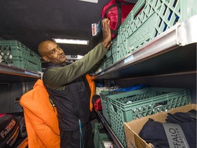 Jamal Damtawe, who works with the UGM, prepares winter supplies to hand out to homeless people during cold weather.