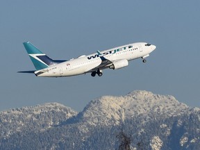 A West Jet plane takes off from Vancouver International Airport in December 2016.