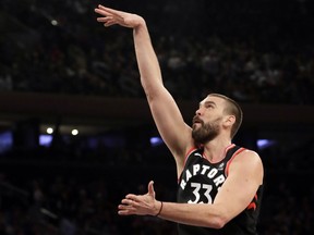 Toronto Raptors' Marc Gasol, right, shoots over New York Knicks' DeAndre Jordan during the first half of an NBA basketball game, Saturday, Feb. 9, 2019, in New York.