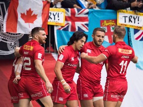 Canada's Nathan Hirayama, centre, celebrates with his teammates after scoring a try against France during World Rugby Sevens Series action, in Vancouver, B.C., on March 11, 2018. The Canadian men's rugby sevens team opens play at the USA Sevens on Friday, looking to build momentum for the Vancouver stop that follows a week later while avoiding injury.