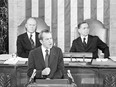 In this Jan. 30, 1974, file photo Vice President Gerald Ford and House Speaker Carl Albert listen to President Richard Nixon deliver his State of the Union address to a joint session of Congress in Washington.