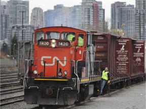 A CN locomotive moves in the rail yards at False creek in a file photo.