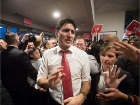 Prime Minister Justin Trudeau, centre, campaigns with Richard T. Lee, back centre, the Liberal candidate in the Burnaby South byelection, in Burnaby, B.C., on Sunday February 10, 2019. Federal byelections will be held on Feb. 25 in three vacant ridings - Burnaby South, where NDP Leader Jagmeet Singh is hoping to win a seat in the House of Commons, the Ontario riding of York-Simcoe and Montreal's Outremont.