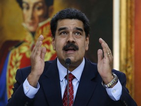 In this file photo dated Friday, Jan. 25, 2019, Venezuelan President Nicolas Maduro gives a press conference at Miraflores presidential palace in Caracas, Venezuela.
