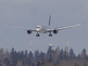 A Virgin Atlantic flight comes in for a landing above other taxiing aircraft, Tuesday, Feb. 5, 2019, at Seattle-Tacoma International Airport in Seattle.