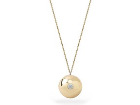 The Boob Locket in yellow gold from Los Angeles-based fine jewelry brand KATKIM.