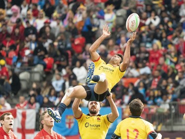 Alejandro Alonso of Spain gets lifted by teammate Manuel Sainz-Trapaga during rugby sevens action against Canada on Day 2 of the HSBC Canada Sevens at BC Place on Sunday, March 10, 2019 in Vancouver.