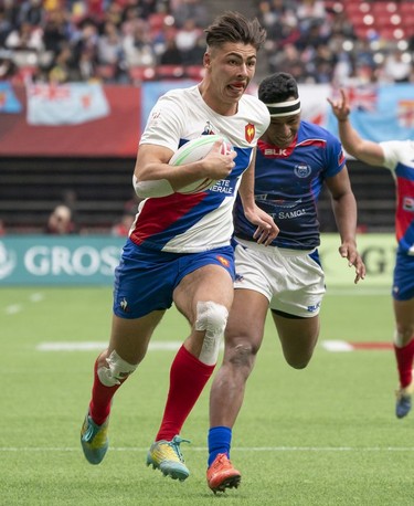 Antoine Zeghdar of France outruns Gasologa Pelenato of Samoa for a try during rugby sevens action on Day 2 of the HSBC Canada Sevens at BC Place on Sunday, March 10, 2019.