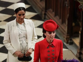 A pregnant Meghan, Duchess of Sussex, follows Catherine, Duchess of Cambridge, as they leave the Commonwealth Service at Westminster Abbey on March 11, 2019 in London, England.