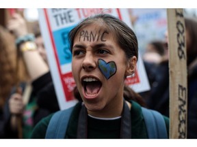 LONDON, ENGLAND - MARCH 15: A girl wears face paint as schoolchildren take part in a student climate protest on March 15, 2019 in London, England. Thousands of pupils from schools, colleges and universities across the UK will walk out today in the second major strike against climate change this year.