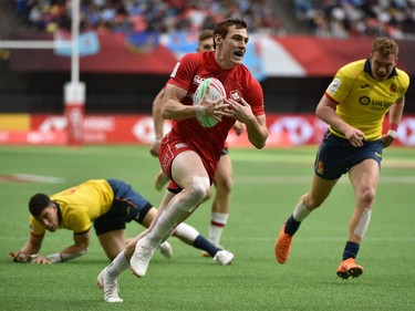 Canada's Phil Berna runs to score a try against Spain during World Rugby Sevens Series action in Vancouver on Sunday, March 10, 2019.