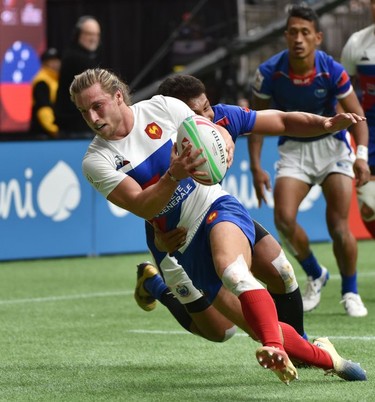 France's Stephen Parez-Edo scores a try against Samoa during the World Rugby Sevens Series in Vancouver on Sunday, March 10, 2019.