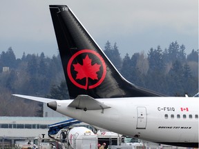A grounded Air Canada Boeing 737 Max 8 plane sits idle at Vancouver International Airport.