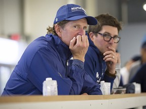 Toronto Maple Leafs coach Mike Babcock, left, and general manager Kyle Dubas watch a scrimmage game during training camp in Niagara Falls, Ont., Sunday, September 16, 2018. (THE CANADIAN PRESS/Aaron Lynett)