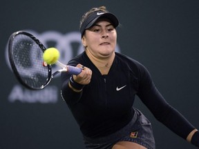 Bianca Andreescu returns a shot to Elina Svitolina at the BNP Paribas Open tennis tournament Friday, March 15, 2019, in Indian Wells, Calif.