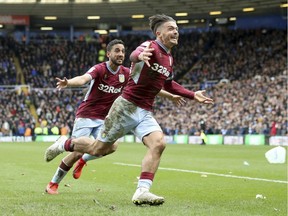 Aston Villa's Jack Grealish (right) celebrates scoring against Birmingham City during their English Championship soccer match at at St Andrew's Trillion Trophy Stadium in Birmingham, England, on Sunday March 10, 2019. A Birmingham fan got onto the pitch earlier in the game and punched Grealish in the head.